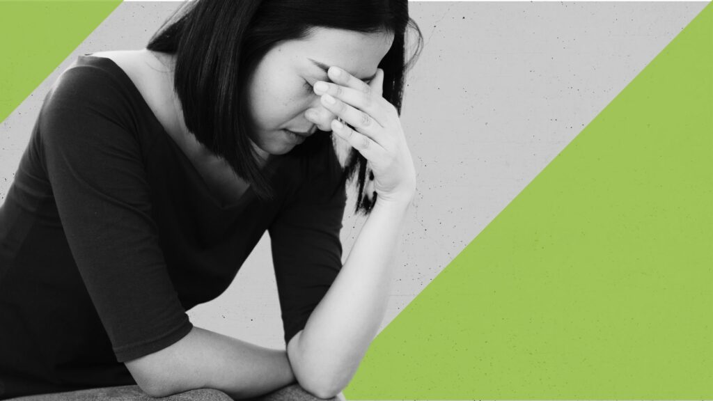 Woman, leaning painfully on her hand