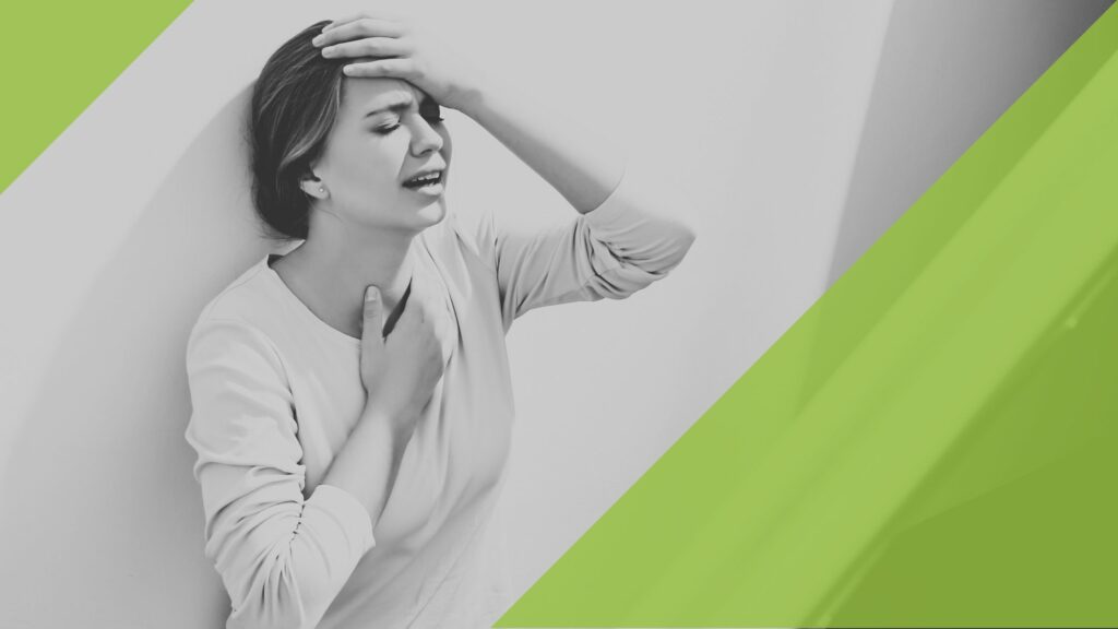Woman holding her head in pain